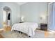 Serene bedroom with hardwood floors, neutral walls, and a walk-in closet for ample storage space at 149 Vista Bluff Ln, Mooresville, NC 28117