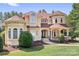 Elegant two-story home boasting a charming facade, manicured lawn and symmetrical design at 149 Vista Bluff Ln, Mooresville, NC 28117