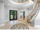 Spacious foyer with tile flooring, grand staircase, and a mosaic design creating an inviting entrance at 149 Vista Bluff Ln, Mooresville, NC 28117