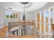 Elegant foyer with a wrought iron banister, chandelier, and high ceilings providing a grand entrance at 149 Vista Bluff Ln, Mooresville, NC 28117
