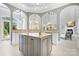 Spacious kitchen with a central island, modern appliances, and plenty of natural light at 149 Vista Bluff Ln, Mooresville, NC 28117