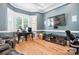 Cozy living room with hardwood floors, bay window, and entertainment center, perfect for relaxation at 149 Vista Bluff Ln, Mooresville, NC 28117