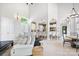 Open-concept living area with high ceilings, archways to an island kitchen, and neutral tones for a bright and airy feel at 149 Vista Bluff Ln, Mooresville, NC 28117