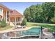 A gorgeous pool with an interlock patio and some furniture sets in the background at 149 Vista Bluff Ln, Mooresville, NC 28117