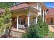 Back porch showcasing an outdoor dining area and a tv overlooking the backyard at 149 Vista Bluff Ln, Mooresville, NC 28117