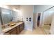 This primary bathroom features double sinks and a glass enclosed shower at 152 Asmodean Ln, Troutman, NC 28166