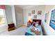 Cozy bedroom with a playful theme, carpeted floors, and a window view at 152 Asmodean Ln, Troutman, NC 28166