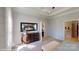 Bedroom view displays a dresser with mirror, bed and opens to the primary bathroom at 152 Asmodean Ln, Troutman, NC 28166