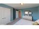 Bright bedroom with ample storage and light blue walls that promotes a tranquil atmosphere at 152 Asmodean Ln, Troutman, NC 28166
