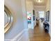 Inviting home hallway with hardwood floors and elegant wainscoting at 152 Asmodean Ln, Troutman, NC 28166