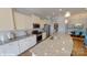 Bright kitchen features granite counters, stainless appliances, and ample cabinet space at 152 Asmodean Ln, Troutman, NC 28166