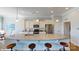 A gourmet kitchen with a large granite island, stainless steel appliances, and barstool seating at 152 Asmodean Ln, Troutman, NC 28166