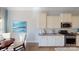 Bright kitchen features white cabinets, stainless steel appliances, and granite countertops at 152 Asmodean Ln, Troutman, NC 28166