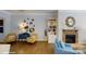 Comfortable living room with hardwood floors, modern decor, a fireplace and great natural light at 152 Asmodean Ln, Troutman, NC 28166