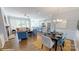 Open-concept living space with a dining area and kitchen featuring stainless steel appliances at 152 Asmodean Ln, Troutman, NC 28166