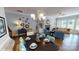 Spacious living area with a stone fireplace, hardwood floors, and stylish decor at 152 Asmodean Ln, Troutman, NC 28166