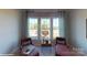 Cozy sitting room showcasing bright windows, stylish decor and plush seating at 152 Asmodean Ln, Troutman, NC 28166