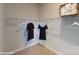 A walk-in closet provides ample storage and organization with hanging rods and shelving at 152 Asmodean Ln, Troutman, NC 28166