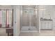 Bright bathroom featuring a glass enclosed shower and granite counters at 15211 Colonial Park Dr, Huntersville, NC 28078