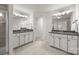 Large bathroom featuring double vanities with granite counters and tile flooring at 15211 Colonial Park Dr, Huntersville, NC 28078