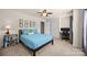 Relaxing bedroom with carpet, a blue comforter, and a large window for natural light at 15211 Colonial Park Dr, Huntersville, NC 28078