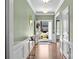 Welcoming foyer with hardwood floors, neutral walls, and a view to the front door and beyond at 15211 Colonial Park Dr, Huntersville, NC 28078
