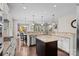 Spacious kitchen features granite counters, a center island, stainless steel appliances, and hardwood floors at 15211 Colonial Park Dr, Huntersville, NC 28078