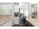 Kitchen with granite counters, center island, stainless fridge and coffee maker at 15211 Colonial Park Dr, Huntersville, NC 28078