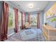 Bright sunroom with large windows, a comfortable armchair, and a stylish area rug at 15211 Colonial Park Dr, Huntersville, NC 28078