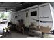 An RV with a covered outdoor seating area is perfect for relaxation and entertainment at 155 Holly Harbor Trl, Mount Gilead, NC 27306