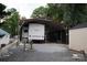The RV with attached carport provides parking and cover from the elements at 155 Holly Harbor Trl, Mount Gilead, NC 27306