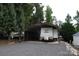 The charming RV with cover offers convenient parking and protection from the elements at 155 Holly Harbor Trl, Mount Gilead, NC 27306
