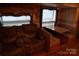 An RV living room offers a cozy seating area with a sofa and dinette at 155 Holly Harbor Trl, Mount Gilead, NC 27306