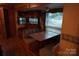 The RV living area includes a dinette and sofa, perfect for relaxing and dining at 155 Holly Harbor Trl, Mount Gilead, NC 27306