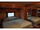 The RV main bedroom offers a queen bed with mirrored closet and overhead storage at 155 Holly Harbor Trl, Mount Gilead, NC 27306