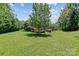 Beautiful backyard with mature trees and a well-maintained lawn at 18800 Boundary Oaks Ct, Davidson, NC 28036