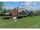 Spacious backyard featuring an outdoor patio and lush greenery, ideal for relaxation and entertainment at 18800 Boundary Oaks Ct, Davidson, NC 28036