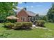 Charming home with a patio area, landscaped yard, and grilling area perfect for entertaining at 18800 Boundary Oaks Ct, Davidson, NC 28036