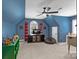 Bedroom with vaulted ceilings, featuring a media center, seating, and neutral carpet at 18800 Boundary Oaks Ct, Davidson, NC 28036