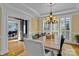 Formal dining area featuring natural light, chandelier lighting, and an open design at 18800 Boundary Oaks Ct, Davidson, NC 28036