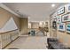 Upstairs hallway featuring carpeted floors, neutral paint, and wooden railing at 18800 Boundary Oaks Ct, Davidson, NC 28036