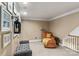 Neutral hallway featuring carpeted floors, chair rail, and gallery wall at 18800 Boundary Oaks Ct, Davidson, NC 28036