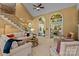 Spacious living room featuring high ceilings, large arched windows, and comfortable seating at 18800 Boundary Oaks Ct, Davidson, NC 28036