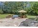 Inviting outdoor patio setup with comfortable seating and greenery, perfect for relaxation at 18800 Boundary Oaks Ct, Davidson, NC 28036