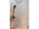 Shower featuring stone tile, modern shower head, and updated fixtures at 18800 Boundary Oaks Ct, Davidson, NC 28036