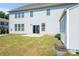Spacious backyard with a sliding glass door, storage shed, and garden beds for outdoor enjoyment and gardening at 2097 Saddlebred Dr, Iron Station, NC 28080