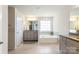 Bright bathroom features a soaking tub, granite countertops, and a double vanity with ample cabinet space at 2097 Saddlebred Dr, Iron Station, NC 28080