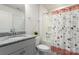 Bright bathroom featuring granite countertops, a bathtub with shower, and a vanity for storage at 2097 Saddlebred Dr, Iron Station, NC 28080