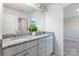 Bathroom featuring double vanity with granite countertop and modern fixtures providing convenience at 2097 Saddlebred Dr, Iron Station, NC 28080