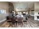 Inviting clubhouse interior with a stone fireplace, comfortable seating, and dining tables for gatherings and socializing at 2097 Saddlebred Dr, Iron Station, NC 28080